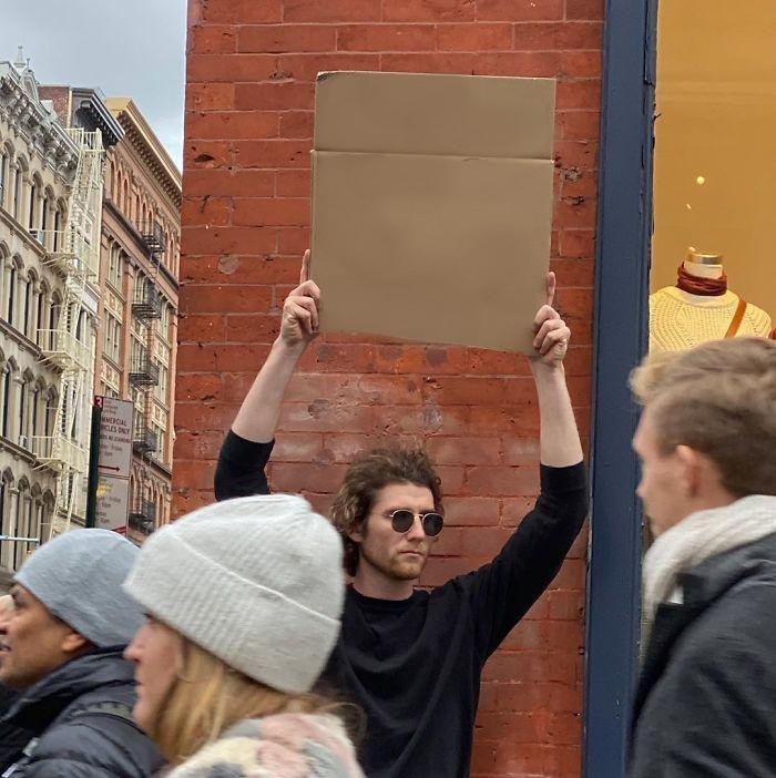 Man Holding Up Sign Meme Preview Image